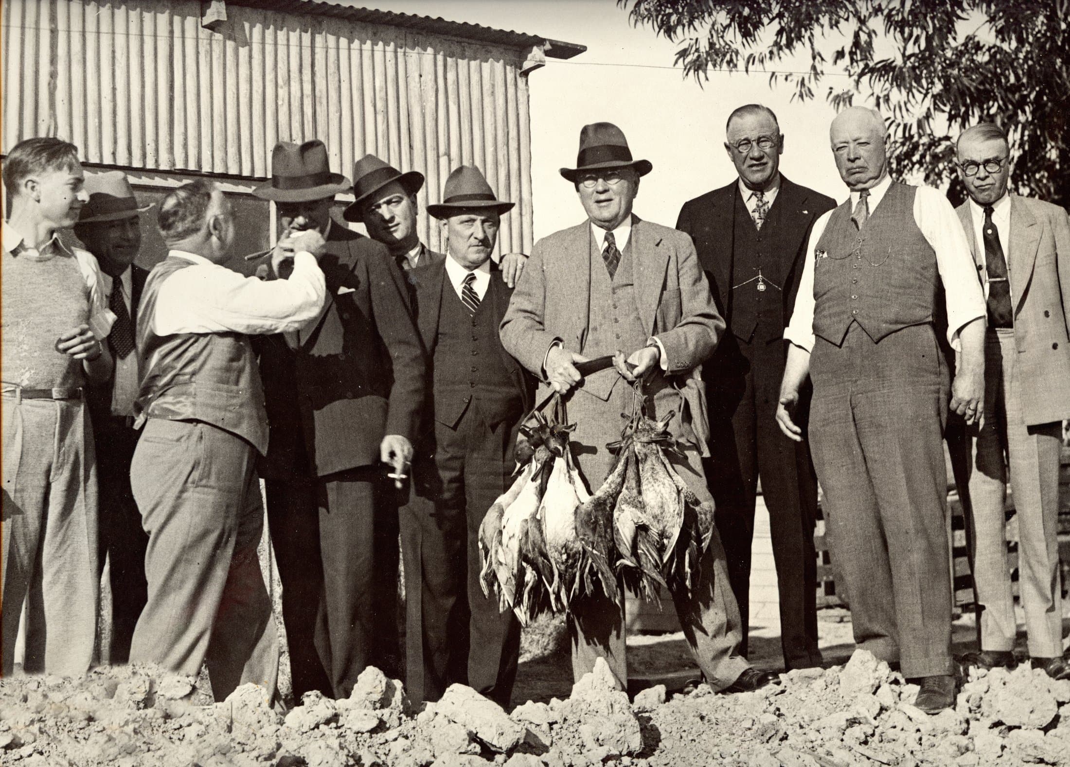 Club members with the day's harvest at Wheeler Island, mid-20th century